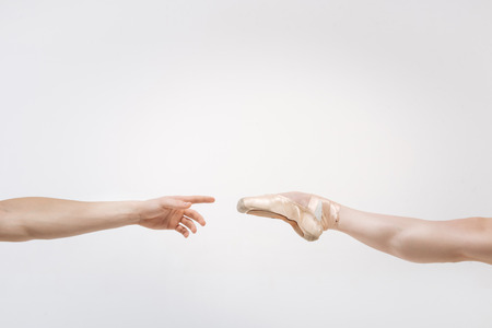 Leg and arm against white backgroundの写真素材