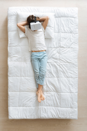 Excited boy using special smart glassesの写真素材