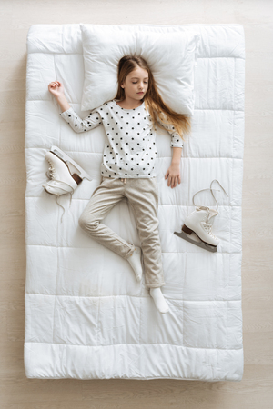 Admirable pretty girl daydreaming about skatingの写真素材