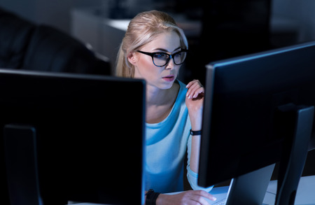 Confident female hacker decoding password codesの写真素材