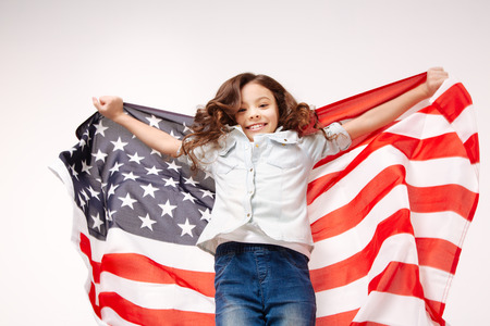 Active cute girl jumping in the studioの写真素材