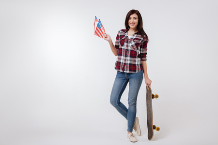 Active young woman representing American nation in the studioの写真素材