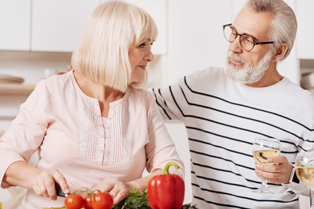 Lovely elderly couple cooking in the kitchenの写真素材