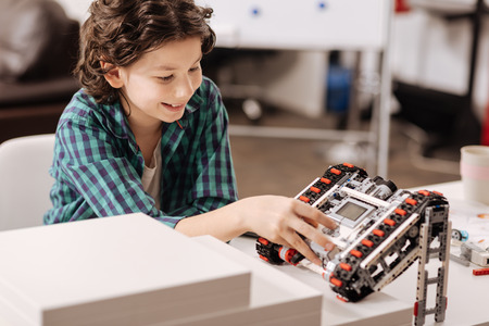 Smart child programming robot in the studioの写真素材