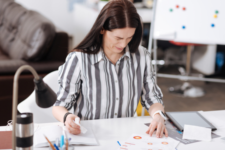 Young brunette woman making facesの写真素材