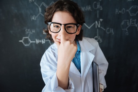 Confident little scientist enjoying experiment in the laboratoryの写真素材