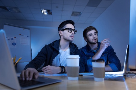 Intelligent male hackers stealing personal data informationの写真素材