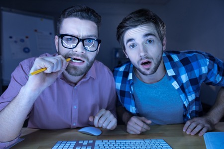 Nice handsome men sitting with his friendsの写真素材