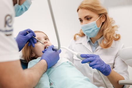 Friendly nice doctors making sure their patient feeling fineの写真素材