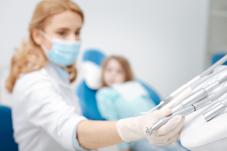 Committed skillful dentist needing special equipmentの写真素材