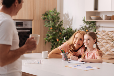 Cheerful family spending weekend at homeの写真素材