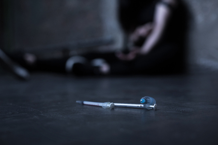 Empty syringes lying in the opium denの写真素材