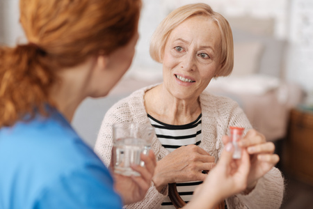 Lovely elderly woman receiving medical assistanceの写真素材
