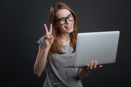 Charming intelligent lady using internet for communicationの写真素材