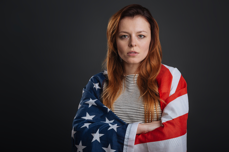 Committed young woman working on patriotic photoshootの写真素材