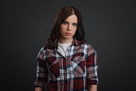 Strong confident young woman looking sadの写真素材