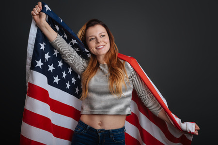 Sincere inspiring woman feeling patrioticの写真素材