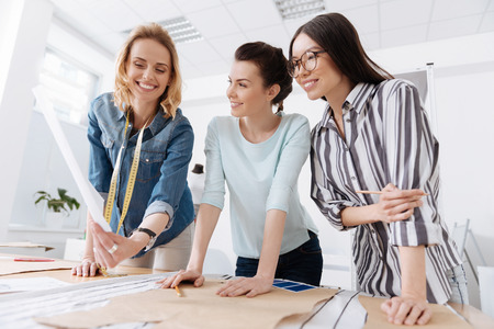 Pretty women checking out the new sketchの写真素材