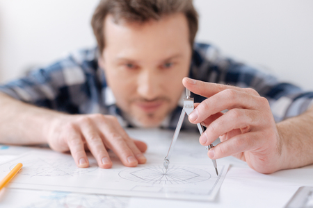 Close up picture of compasses being in male handの写真素材