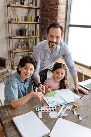Happy single-parent family creating a landscape picture
