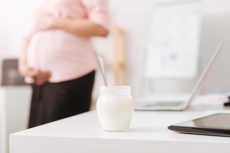 Selective focus of jogurt standing on the tableの写真素材