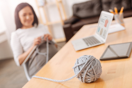 Close up of ball of threads on the tableの写真素材