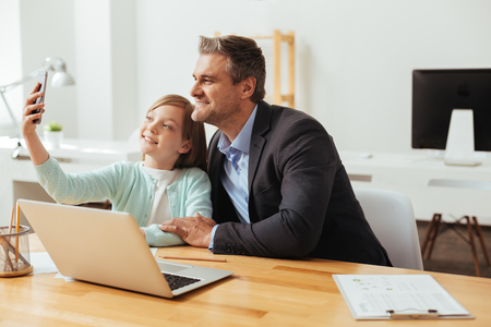 Adorable productive family taking a selfie togetherの写真素材