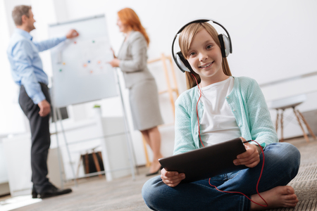Admirable brilliant child playing with a tabletの写真素材