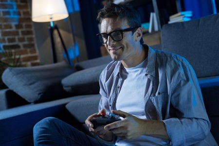 Determined fun genuine man completing one more levelの写真素材