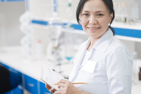 Cheerful delighted researcher looking at youの写真素材