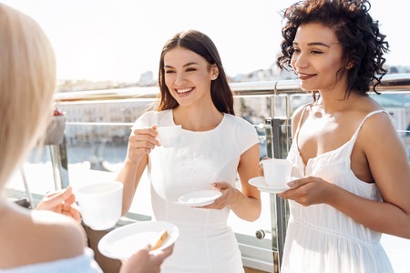 Delighted young women enjoying their time togetherの写真素材