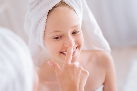 Portrait of joyful girl that playing with her momの写真素材