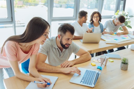 Cheerful delighted woman taking notesの写真素材