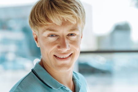 Portrait of joyful handsome light haired manの写真素材