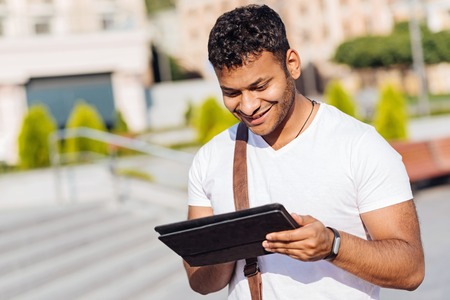 Good looking male person searching necessary placeの写真素材