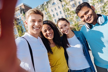Smiling young people doing selfie pictureの写真素材