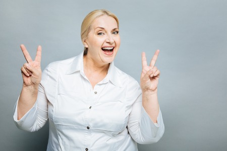 Funny senior woman making facesの写真素材