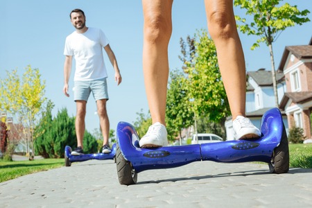 Close up of female legs on self-balancing scooter