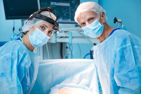 Attentive medical workers posing on cameraの写真素材