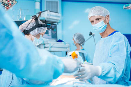 Serious mature surgeon looking forwardの写真素材