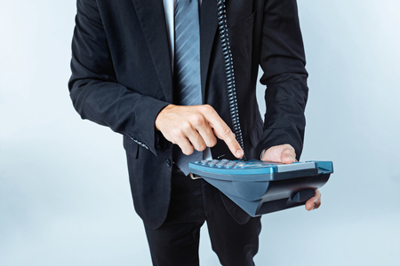 Close up of office worker making telephone callの写真素材