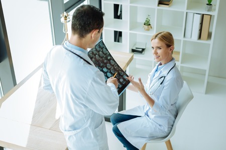 Smart nice doctors discussing the diagnosisの写真素材