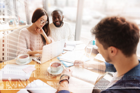 Intelligent students working in casual atmosphereの写真素材