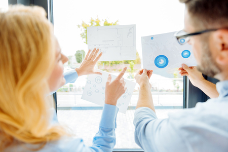 Two office workers learning diagramの写真素材