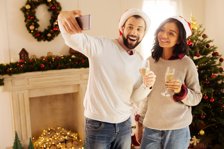 Cheerful couple taking selfie on New Year Eveの写真素材