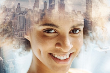 Pretty smiling girl expressing happiness and pleasureの写真素材