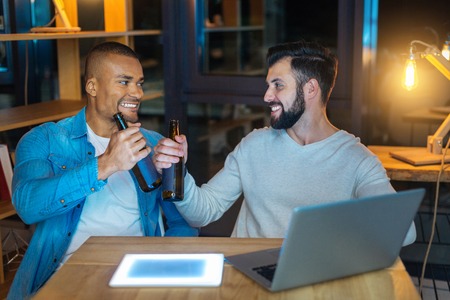 Handsome bearded man going to drink beerの写真素材