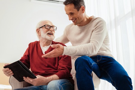 Low angle photo of two males that enjoying free timeの写真素材