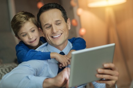 Portrait of delighted men that watching filmの写真素材