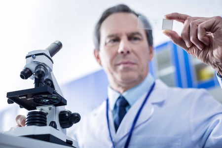 Modern biology studies. Selective focus of microscope equipment being used for biological researchの写真素材